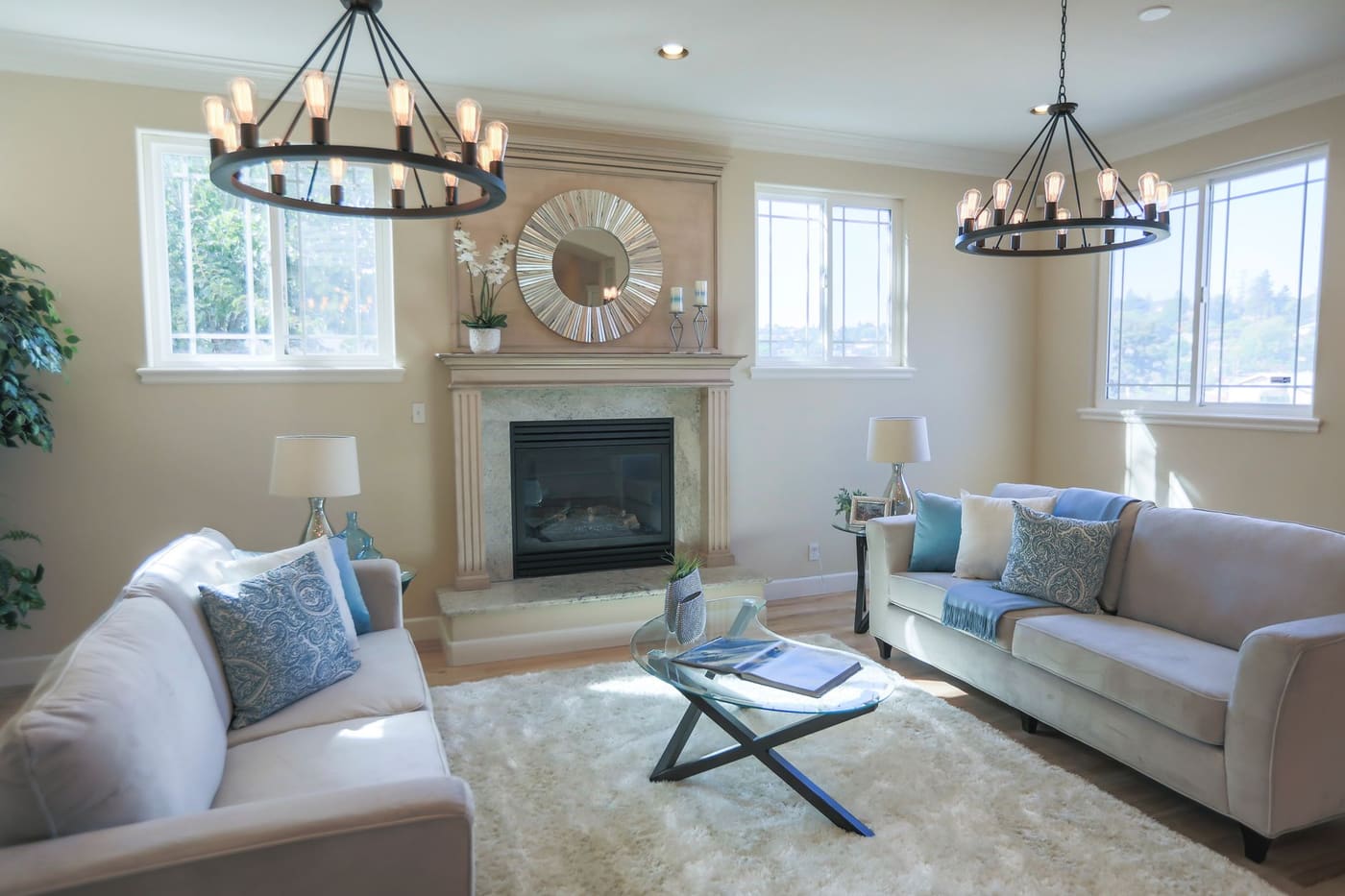 Living room with two sofas facing each other in front of a fireplace, with a coffee table between them